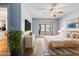 Bright primary bedroom with access to a screened porch through a sliding glass door at 8975 Sw 202Nd Avenue Rd, Dunnellon, FL 34431