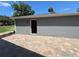 Large back patio with brick pavers and access to the home at 274 Se 34Th Pl, Ocala, FL 34471