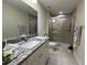 Bathroom with granite countertop and walk-in shower at 274 Se 34Th Pl, Ocala, FL 34471