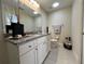 Bathroom with granite countertop and white cabinets at 274 Se 34Th Pl, Ocala, FL 34471