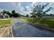 Gravel driveway with new landscaping and an irrigation system at 274 Se 34Th Pl, Ocala, FL 34471