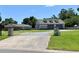 Long gravel driveway leading to a house and garage at 274 Se 34Th Pl, Ocala, FL 34471