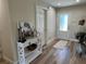 Light and airy entryway with a console table, wall art, and hardwood floors at 274 Se 34Th Pl, Ocala, FL 34471