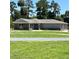 Ranch style home with stone and gray siding at 274 Se 34Th Pl, Ocala, FL 34471