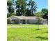 Ranch style home with stone and gray siding at 274 Se 34Th Pl, Ocala, FL 34471