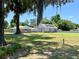 House and garage with large yard and trees at 274 Se 34Th Pl, Ocala, FL 34471