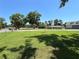 Spacious grassy lot with mature trees and a new home visible in the background at 274 Se 34Th Pl, Ocala, FL 34471