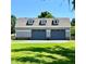 Detached two-car garage with dormer windows at 274 Se 34Th Pl, Ocala, FL 34471