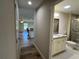 Hallway view showing a kitchen and bathroom at 274 Se 34Th Pl, Ocala, FL 34471