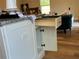 Kitchen island with drawers, open shelving, and granite countertop at 274 Se 34Th Pl, Ocala, FL 34471