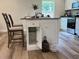 Kitchen island with storage, granite countertops, and two barstools at 274 Se 34Th Pl, Ocala, FL 34471