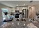 Bright kitchen featuring white cabinets and granite countertops at 274 Se 34Th Pl, Ocala, FL 34471