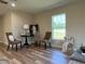 Cozy sitting area with hardwood floors and large windows at 274 Se 34Th Pl, Ocala, FL 34471