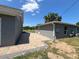 Home's side yard with paver patio and grassy area at 274 Se 34Th Pl, Ocala, FL 34471