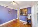 Bright bedroom features refinished hardwood floors and an open doorway to an adjacent room at 1226 Se 9Th Ave, Ocala, FL 34471