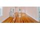 Pink bedroom with hardwood floors and window at 1226 Se 9Th Ave, Ocala, FL 34471