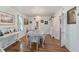 Charming dining room with hardwood floors, white furniture, and elegant chandelier at 1226 Se 9Th Ave, Ocala, FL 34471