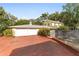 Brick driveway leading to a two-car garage at 1226 Se 9Th Ave, Ocala, FL 34471