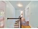 Hallway featuring hardwood floors, multiple doors, and a classic oriental rug at 1226 Se 9Th Ave, Ocala, FL 34471