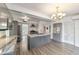 Bright kitchen with grey cabinets, island sink, stone countertops, and stainless steel appliances at 1226 Se 9Th Ave, Ocala, FL 34471