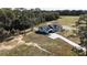 Aerial view of a house on a spacious lot with a long driveway at Tbd W C 466 # Lot 1, Oxford, FL 34484