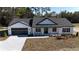 Aerial view of a white farmhouse with a black roof at Tbd W C 466 # Lot 1, Oxford, FL 34484