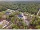 Spacious aerial view of a new home surrounded by lush green forest at 13359 Sw 80Th St, Dunnellon, FL 34432