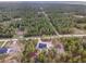 Scenic aerial view of a home in a lush forest setting at 13359 Sw 80Th St, Dunnellon, FL 34432