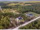 Expansive aerial view of a new home surrounded by lush green forest and large lots at 13359 Sw 80Th St, Dunnellon, FL 34432
