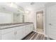 Bathroom featuring double sinks, granite countertops, and a glass-enclosed shower at 13359 Sw 80Th St, Dunnellon, FL 34432