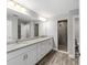Bathroom featuring double sinks, granite countertops, and a glass-enclosed shower at 13359 Sw 80Th St, Dunnellon, FL 34432