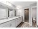 Bathroom featuring double sinks, granite countertops, and a glass-enclosed shower at 13359 Sw 80Th St, Dunnellon, FL 34432