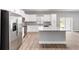 A well-equipped kitchen boasts stainless steel appliances and a large center island at 13359 Sw 80Th St, Dunnellon, FL 34432