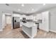 A modern kitchen features stainless appliances, a center island, and ample cabinet space at 13359 Sw 80Th St, Dunnellon, FL 34432