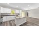 Modern kitchen featuring an island, stainless steel appliances and granite countertops at 13359 Sw 80Th St, Dunnellon, FL 34432
