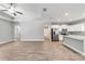 An open layout features hardwood floors and connects the living area to the kitchen at 13359 Sw 80Th St, Dunnellon, FL 34432