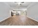 Open-concept floor plan with wood-look floors and gray kitchen island at 13359 Sw 80Th St, Dunnellon, FL 34432