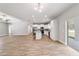 Spacious living room with an open-concept design, connecting to the kitchen and dining area at 13359 Sw 80Th St, Dunnellon, FL 34432