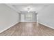 Bright living room boasts hardwood floors, high ceilings and a front door at 13359 Sw 80Th St, Dunnellon, FL 34432