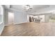 A spacious living room with wood floors flowing into the kitchen at 13359 Sw 80Th St, Dunnellon, FL 34432