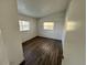 Well-lit bedroom featuring wood-look floors and window at 2 Se Chinica Dr, Summerfield, FL 34491