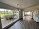 Dining area with hardwood floors and lake view at 2 Se Chinica Dr, Summerfield, FL 34491