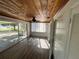 Sunlit living room with sliding glass doors leading to patio at 2 Se Chinica Dr, Summerfield, FL 34491