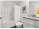 Clean bathroom with granite countertop, shower/tub combo, and white cabinet at 16588 Sw 25Th Terrace Rd, Ocala, FL 34473