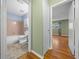 View into a bathroom with light pink tile, white fixtures and neutral paint color at 8655 Sw 98Th Street Rd # G, Ocala, FL 34481
