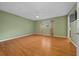 Bedroom with natural light, wood floors, neutral paint and ceiling fan at 8655 Sw 98Th Street Rd # G, Ocala, FL 34481