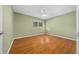 Bedroom with hardwood floors and a window letting in natural light at 8655 Sw 98Th Street Rd # G, Ocala, FL 34481