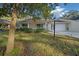Charming single-story home with a covered porch and manicured front yard at 8655 Sw 98Th Street Rd # G, Ocala, FL 34481