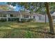 Inviting single-story home featuring a cozy front porch with white columns and trimmed landscaping at 8655 Sw 98Th Street Rd # G, Ocala, FL 34481