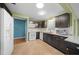 Traditional kitchen featuring brown cabinets, white appliances, and neutral granite countertops at 8655 Sw 98Th Street Rd # G, Ocala, FL 34481